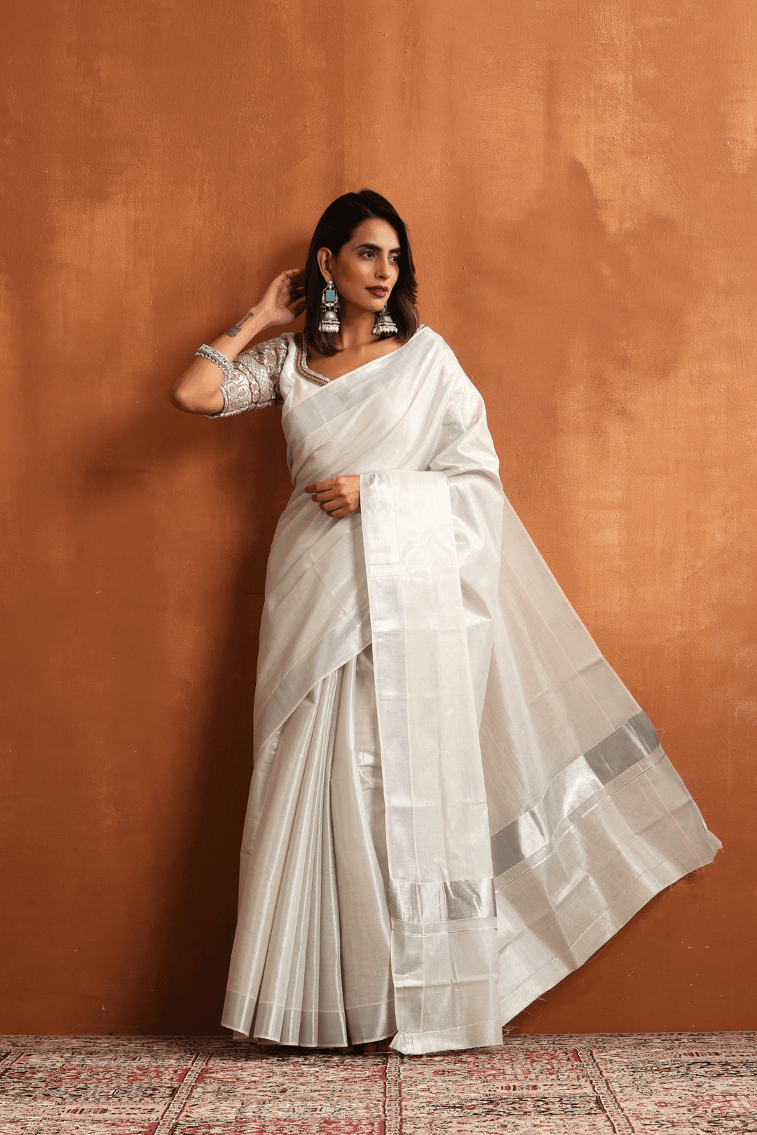 Ready to wear white Kasavu saree with silver border, pre-stitched pleats – Glamwiz
